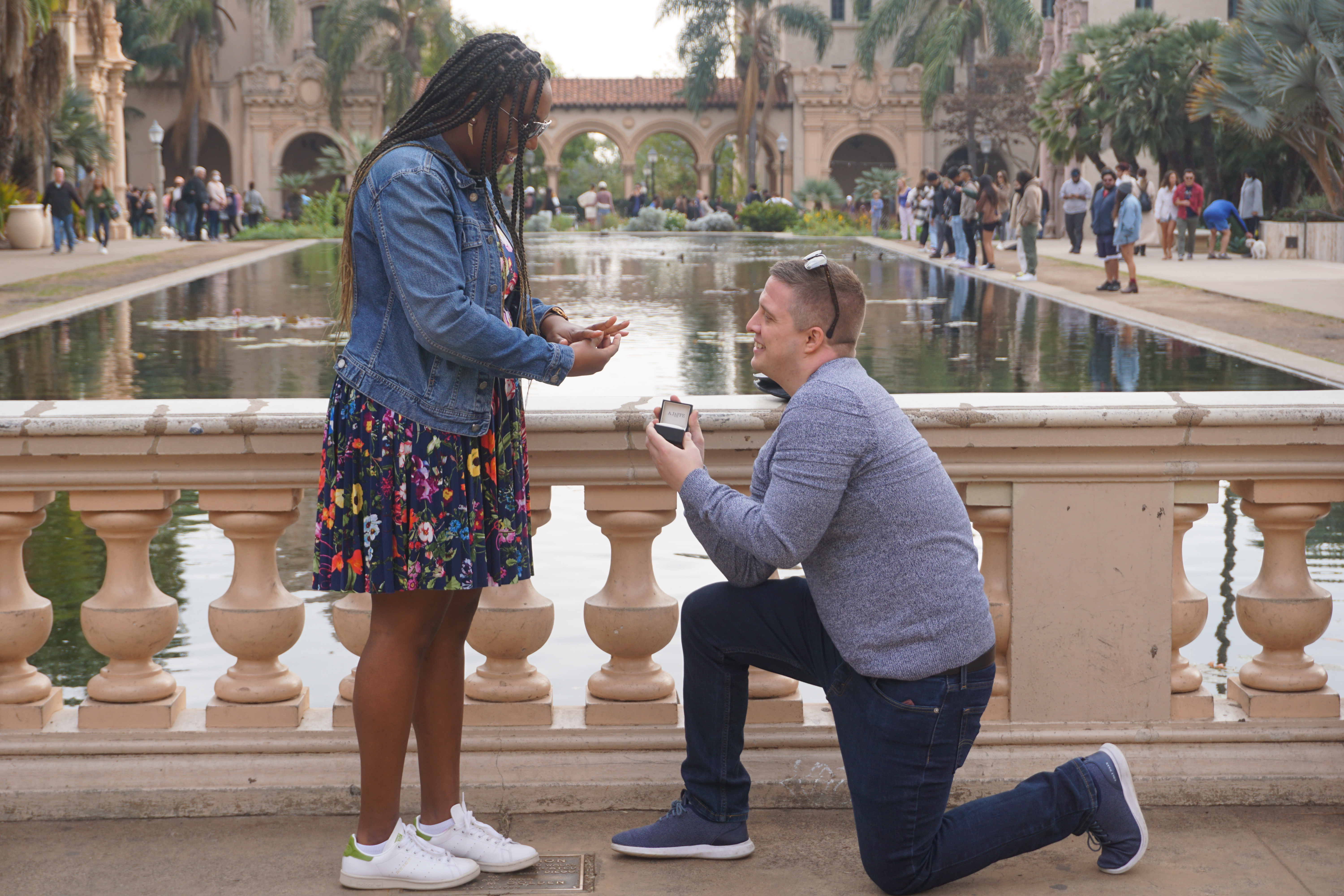 Man kneeling to propose to wife